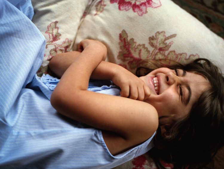 A young girl playing and laughing, Somerset, UK, 2008 A young girl playing and laughing, Somerset, UK, 2008