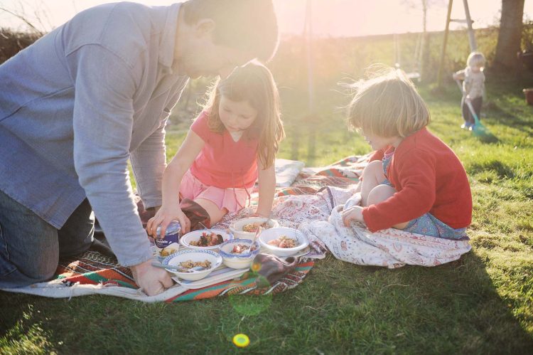 Family picnic in the garden. Somerset, UK Family picnic in the garden. Somerset, UK